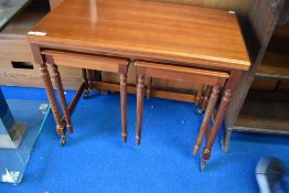 'A vintage nest of light mahogany tables, having Adams style legs, by