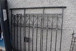 A wrought iron drive way gate and fence (no key)