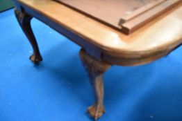 An early 20th century extending dining table with two leafs.