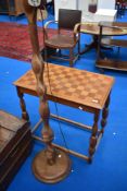 A marquetry top occasional table and similar standard lamp