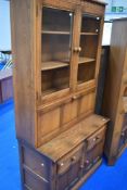 A modern Ercol mid stain display/cocktail unit