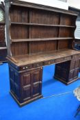 A 19th Century and later dresser/sideboard having panelled pedestal base, with stained pine tongue