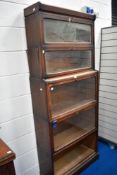 A late 19th or early 20th Century oak stacking bookcase, having 2 shallow and 3 deep tiers (no glass