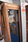 An interesting and unusual oak longcased electric clock , AC frequency control, together with