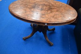 A 19th Century walnut oval breakfast table on turned columns and triple splay legs, max width