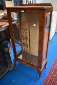 A mid 20th Century walnut veneered china cabinet