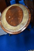 A reproduction Regency style oval coffee table