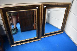 A pair of decorative wall mirrors