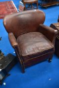 A modern leather small tub chair