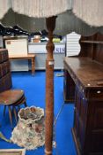 An oriental wood standard lamp
