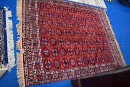 An attractive Persian Belouch/Bokhara design rug, most likely machine loomed, 200cm x 140cm