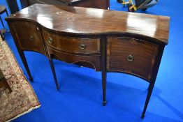 A reproduction Regency serpentine front sideboard