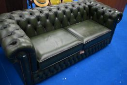 A traditional green leather chesterfield style settee, width approx. 190cm