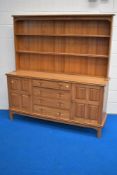 A craftsman made ash dresser, of traditional arrangement with two-tier plate rack, over the oblong