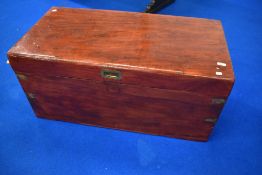 A stained frame campaign style bedding chest