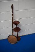 A traditional bed warming pan and smokers stand