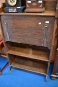 An Art Nouveau oak slim bureau with shelf under