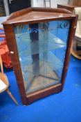 An early to mid 20th Century walnut corner display