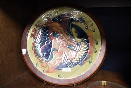 A large modern Moorcroft pottery 'Quiet Waters' patern charger. Designed by Philip Gibson and tube