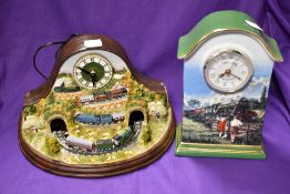 Two modern train themed clocks