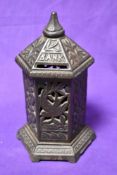 A vintage cast metal penny bank