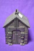 A vintage Novelty piggy bank, modelled as Noddys house