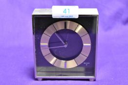 A 1970s Swiza 8 desk alarm clock, 10.5cm tall