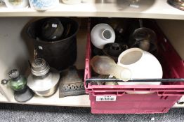 A collection of oil lamp and burner parts, including glass chimneys, bases and similar, also
