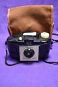 A vintage Kodak Brownie 127 camera and case