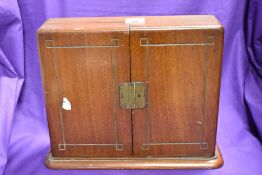 A Victorian mahogany display cabinet, the two doors opening to a later mirrored mosaic interior,