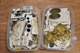 A collection of vintage and antique buttons, including some with ornate examples and unusual