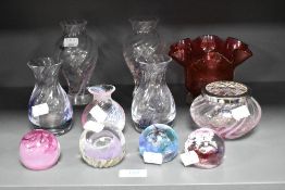 A small collection of Caithness and similar paperweights and vases, and a Victorian ruby glass vase