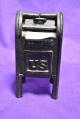 A novelty cast metal money bank modelled as US post box
