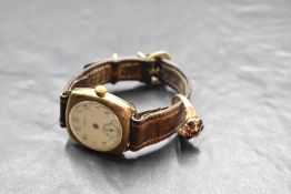 A gent's 9ct gold wrist watch by Waltham, no: 28921702 having Arabic numeral dial with subsidiary