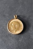 A 1918 gold half sovereign in a removable 9ct gold pendant mount, approx 4.7g