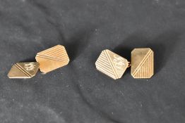 A pair of 9ct gold having monogrammed panels with chain connectors, approx 4.5g