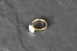 A cubic zirconia halo ring on a 9ct gold loop, size M & approx 2.1g