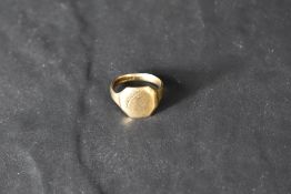 A 9ct gold signet ring having worn decorative engraving to square panel, size N & approx 4.4g