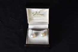 A pair of cultured pearl earrings having 9ct gold posts