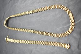 A 9ct gold brick link collerette necklace and matching bracelet, both having concealed clasps,