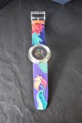 A Swatch 'Veruschka Pop' wristwatch with gift box, papers and outer packaging.