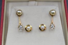 Two pairs of cultured pearl stud earrings, one pair stamped 9ct, one pair having detachable