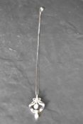 A 9ct white gold antique style opal and diamond chip pendant on a 9ct white gold fine curb link