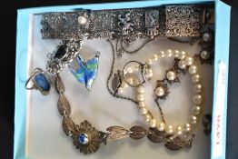 A small selection of silver and white metal jewellery including filligree bracelets, pearl