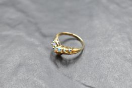 A five stone opal wish bone ring in a claw set mount to moulded 14ct gold loop, size Q & approx 2.