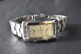 A ladies DKNY duel time quartz wristwatch, with branded box, outer card box and guarantee.