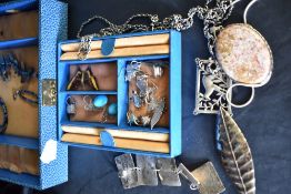 A selection of HM silver and white metal jewellery including pendants, muff chain, enamelled