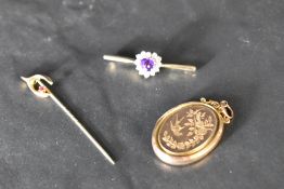 A 9ct gold bar brooch having amethyst and cubic zirconia decoration, a wishbone stick pin and a