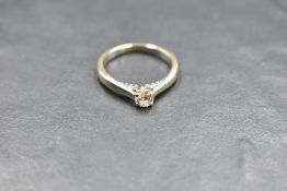 A diamond solitaire ring having diamond set mount, total approx 0.45ct in a 4 claw setting on an