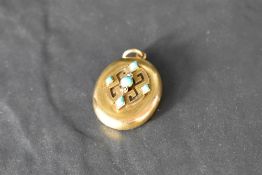 A Victorian yellow metal locket having turquoise and diamond decoration, no marks but presumed gold,